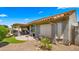 Backyard featuring a covered patio with outdoor furniture and desert landscaping at 27057 W Tonopah Dr, Buckeye, AZ 85396