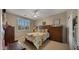 Bedroom with neutral carpet, plantation shutters, and a bed at 27057 W Tonopah Dr, Buckeye, AZ 85396