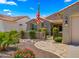 Charming single-story home featuring a tile roof, desert landscaping, and inviting curb appeal at 27057 W Tonopah Dr, Buckeye, AZ 85396