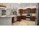 Well-appointed kitchen with stainless steel appliances, granite countertops, and ample storage space at 27057 W Tonopah Dr, Buckeye, AZ 85396