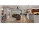 Open concept living space with tile flooring, a fireplace, and access to the dining area at 27057 W Tonopah Dr, Buckeye, AZ 85396