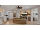 Open concept living space with tile flooring, a decorative fireplace, and recessed lighting at 27057 W Tonopah Dr, Buckeye, AZ 85396