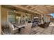 Covered patio boasts ample seating and a ceiling fan, perfect for enjoying the outdoors at 27057 W Tonopah Dr, Buckeye, AZ 85396