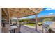 Outdoor living space with comfortable patio furniture, a grill, and manicured yard at 27057 W Tonopah Dr, Buckeye, AZ 85396
