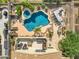 Aerial view of backyard featuring pool, spa, outdoor kitchen, fire pit, and lounge seating at 2758 N Sterling --, Mesa, AZ 85207