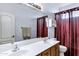Bathroom with dual sinks, wood cabinetry, and a large mirror at 2758 N Sterling --, Mesa, AZ 85207