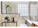 Shower with light countertops, glass block window, bench seating, and a black showerhead at 2758 N Sterling --, Mesa, AZ 85207