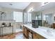 Spacious bathroom with double sinks, granite countertops, glass block window, and tile floor at 2758 N Sterling --, Mesa, AZ 85207