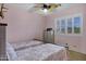 Cozy bedroom with ceiling fan, and bright natural light at 2758 N Sterling --, Mesa, AZ 85207