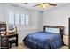 Bedroom with hardwood bedframe, vanity, and large bright window at 2758 N Sterling --, Mesa, AZ 85207