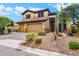 Charming two-story home with a three-car garage and well-maintained desert landscaping at 2758 N Sterling --, Mesa, AZ 85207