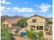 Exterior view of home showcasing pool, mature landscaping, and mountain views at 2758 N Sterling --, Mesa, AZ 85207