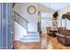 Elegant foyer with high ceilings, staircase, and tile flooring leading to the dining room at 2758 N Sterling --, Mesa, AZ 85207