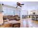 Open-concept living room with abundant natural light, tile flooring, and a ceiling fan at 2758 N Sterling --, Mesa, AZ 85207