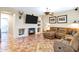 Comfortable living room with a fireplace and tile floors, perfect for relaxing at 2758 N Sterling --, Mesa, AZ 85207