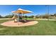 Community playground in desert setting with slides, swings, and covered picnic area at 2758 N Sterling --, Mesa, AZ 85207