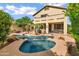 Backyard pool and spa with stone accents, palm trees, and plenty of lounge seating at 2758 N Sterling --, Mesa, AZ 85207