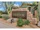Stone monument sign for Grayfox community entrance with desert landscaping and native trees at 2758 N Sterling --, Mesa, AZ 85207