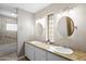 Bright bathroom with dual sinks, granite countertops, and tile flooring at 2923 N 81St Pl, Scottsdale, AZ 85251