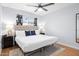 Spacious bedroom featuring a plush bed, modern lamps, and hardwood floors at 2923 N 81St Pl, Scottsdale, AZ 85251