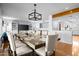Elegant dining room with a large table set for a formal meal, complemented by modern lighting and decor at 2923 N 81St Pl, Scottsdale, AZ 85251