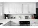 Well-organized kitchen featuring white cabinetry, subway tile backsplash, and stainless steel appliances at 2923 N 81St Pl, Scottsdale, AZ 85251