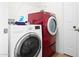 Laundry room features red and white stacked washer and dryer sets at 2923 N 81St Pl, Scottsdale, AZ 85251