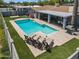 Aerial view of a backyard pool area with an outdoor kitchen and chairs at 2923 N 81St Pl, Scottsdale, AZ 85251