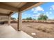 Covered patio overlooking the backyard, perfect for relaxing and outdoor living at 3022 N Lainey Ln, Buckeye, AZ 85396