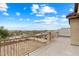 Relaxing balcony boasting stunning neighborhood and distant landscape views under a bright sky at 3022 N Lainey Ln, Buckeye, AZ 85396