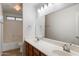 Bright bathroom with double sinks, vanity, and well-lit vanity mirrors at 3022 N Lainey Ln, Buckeye, AZ 85396