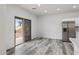 Dining area with stainless steel refrigerator and sliding door access to the backyard at 3022 N Lainey Ln, Buckeye, AZ 85396