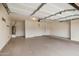 Spacious garage featuring ample storage and parking, illuminated by overhead lighting at 3022 N Lainey Ln, Buckeye, AZ 85396