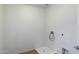 Practical laundry room with tile flooring and essential connections ready for washer and dryer at 3022 N Lainey Ln, Buckeye, AZ 85396
