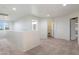 Upstairs loft area with neutral carpet, bright windows, and multiple doorways at 3022 N Lainey Ln, Buckeye, AZ 85396