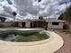 Exterior view of home showing the backyard with a pool needing renovation at 3125 N 82Nd Pl, Scottsdale, AZ 85251