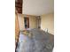 Bedroom showing interior demolition with exposed studs and unfinished flooring, ready for remodeling at 3125 N 82Nd Pl, Scottsdale, AZ 85251