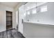 Walk-in shower featuring white tile, dual shower heads, and glass partition at 32366 N 133Rd Ln, Peoria, AZ 85383