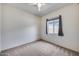Bedroom featuring neutral carpet, white walls, and natural light from the window at 32366 N 133Rd Ln, Peoria, AZ 85383