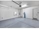 Spacious two-car garage with sealed concrete floors at 32366 N 133Rd Ln, Peoria, AZ 85383
