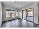 Bright sun room with tiled floors and large glass doors to the outdoors at 32366 N 133Rd Ln, Peoria, AZ 85383