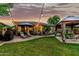 Backyard featuring a lush lawn, patio area, lounge chairs, and a gazebo at 3628 E Meadowview Dr, Gilbert, AZ 85298
