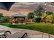 Inviting backyard featuring a gazebo, lush lawn, and elegant water feature, perfect for relaxing evenings at 3628 E Meadowview Dr, Gilbert, AZ 85298
