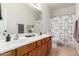 Light and bright bathroom with double sinks, a large mirror, and a shower at 3628 E Meadowview Dr, Gilbert, AZ 85298