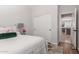 This light-filled bedroom features a view into the kitchen and a closet with doors at 3628 E Meadowview Dr, Gilbert, AZ 85298