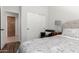 Bright bedroom with floral bedding, a black chair, and closet with classic style doors at 3628 E Meadowview Dr, Gilbert, AZ 85298