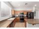Well-equipped kitchen features wooden cabinets, stainless steel appliances, and neutral countertops at 3628 E Meadowview Dr, Gilbert, AZ 85298