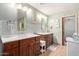 Bathroom featuring and sinks with sleek cabinets at 36801 N Long Rifle Rd, Carefree, AZ 85377