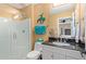 Bathroom with glass enclosed shower, single sink, and wall mounted towel racks at 36801 N Long Rifle Rd, Carefree, AZ 85377