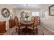 Elegant dining room featuring a round table, chandelier, and stylish accents at 36801 N Long Rifle Rd, Carefree, AZ 85377